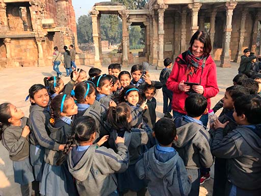 Tourist in an Indian school interacting with students.