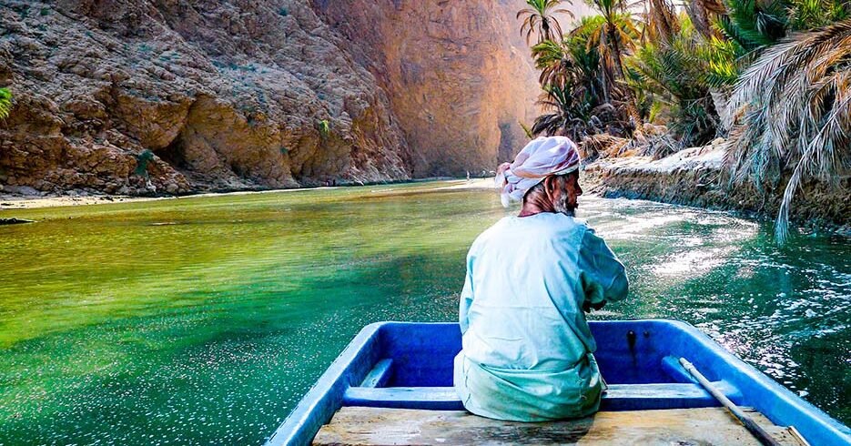 Wadi Shab Man with Boat 935x543