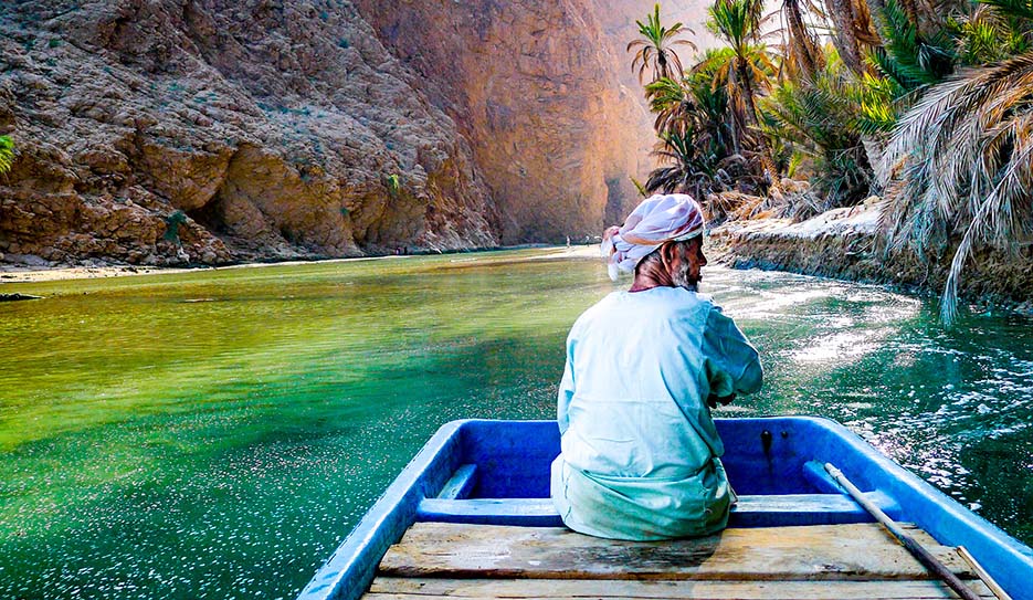 Wadi Shab Man with Boat 935x543