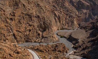 canyon and view of the winding road to Jebel Al Harim (Jabal Al Harim