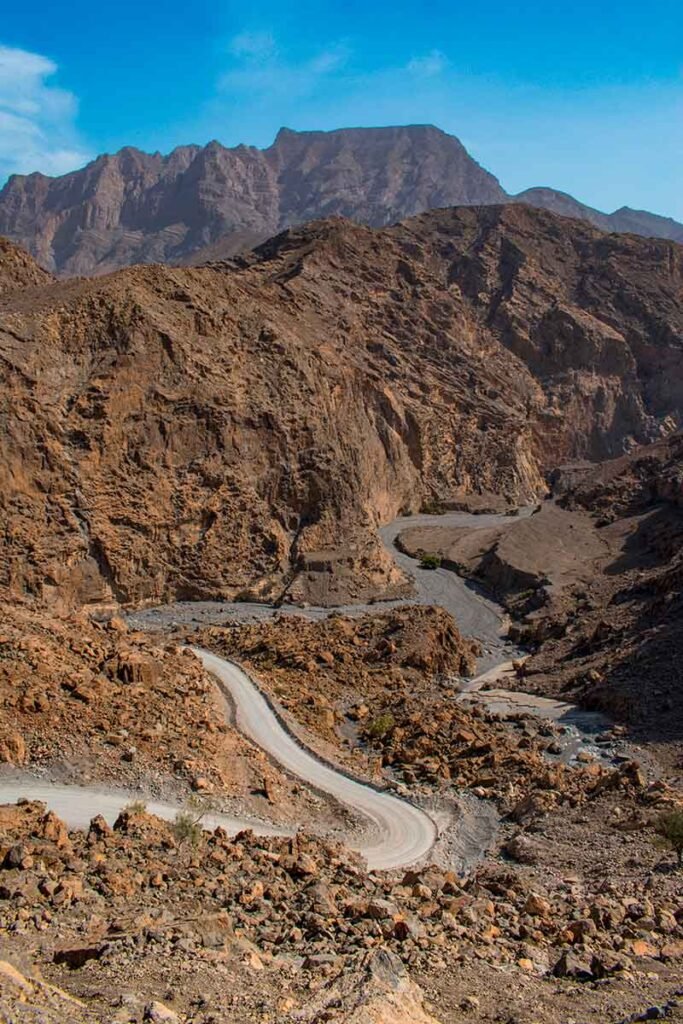 canyon and view of the winding road to Jebel Al Harim (Jabal Al Harim