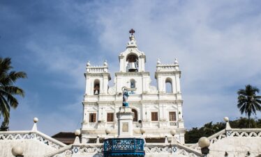 architecture, travel, sky, church, tourism, building, city, religion, outdoors, tower, town, sight, exterior, nature, ancient, house, culture, landmark, traditional, old, goa, historic, attraction, asia, sightseeing, heritage, design, historical, history, destination, blue history, blue culture